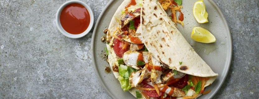Turkish chicken shish with fresh vegetables and flatbread